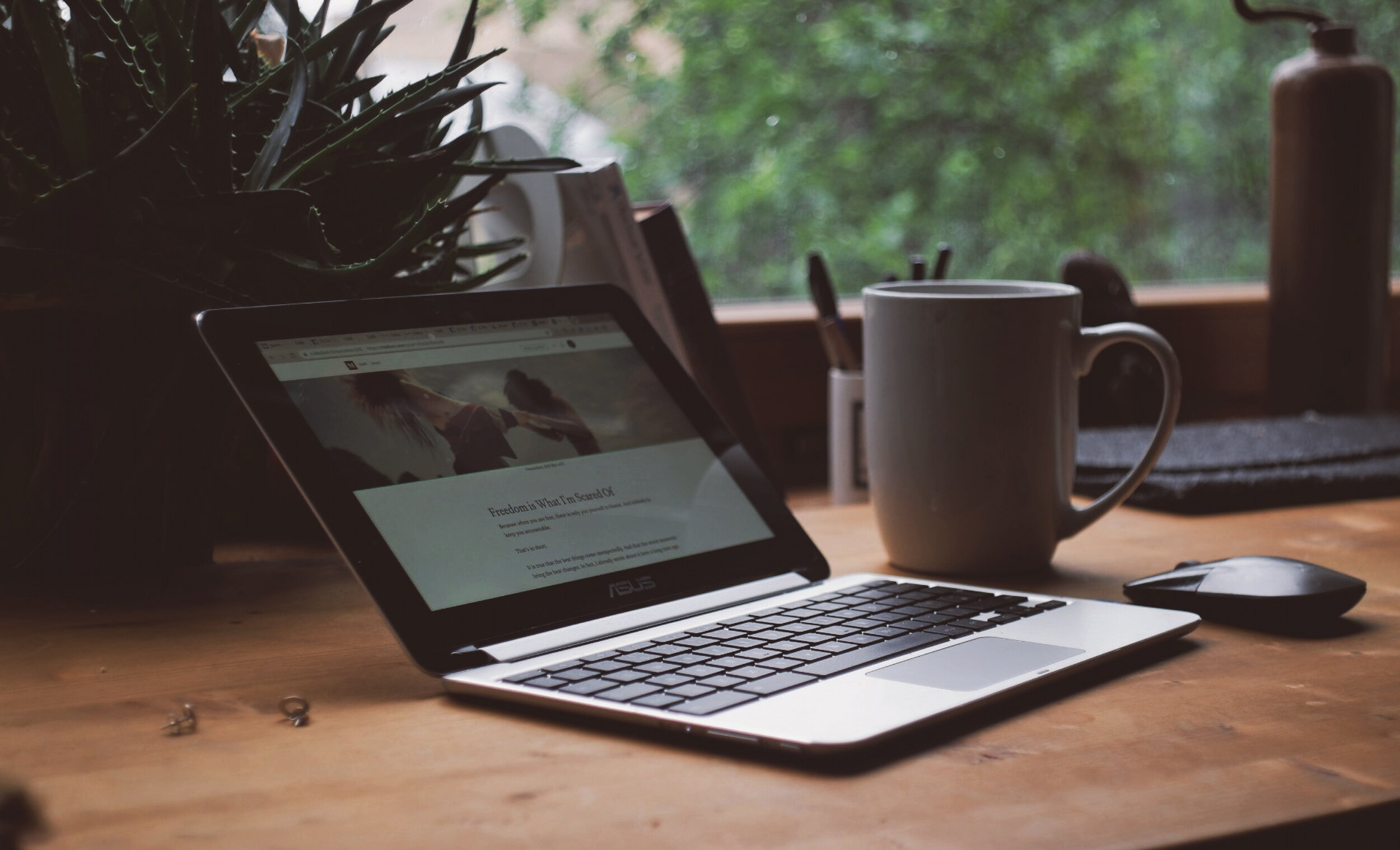 A laptop sat on a home office desk